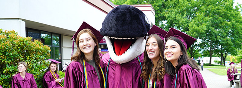 Graduate students with Orca mascot