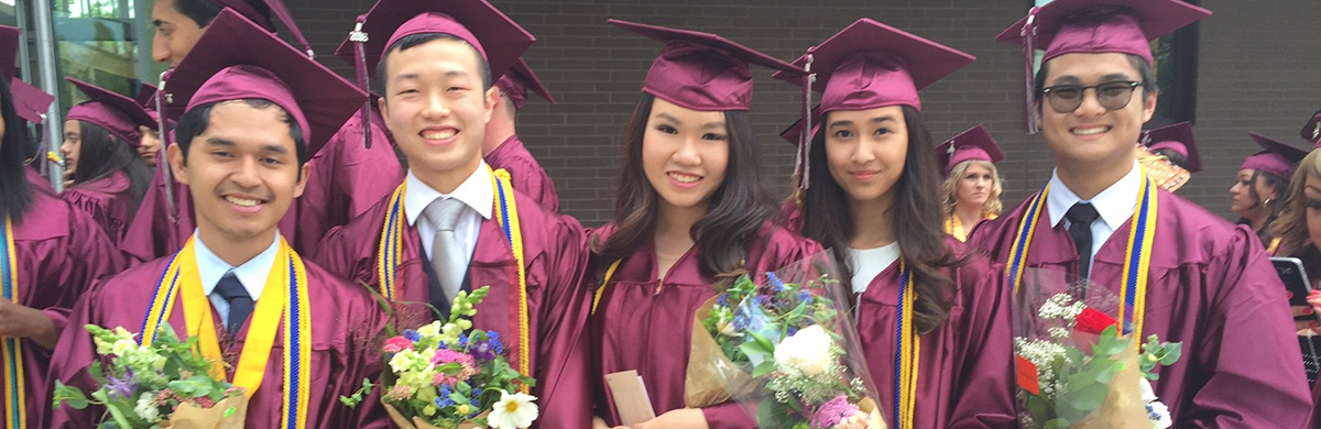 Five International students from Indonesia posing with flowers at Graduation ceremony