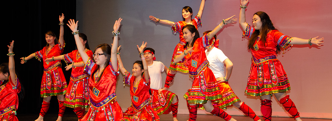 International Night dancers in bright red traditional clothing