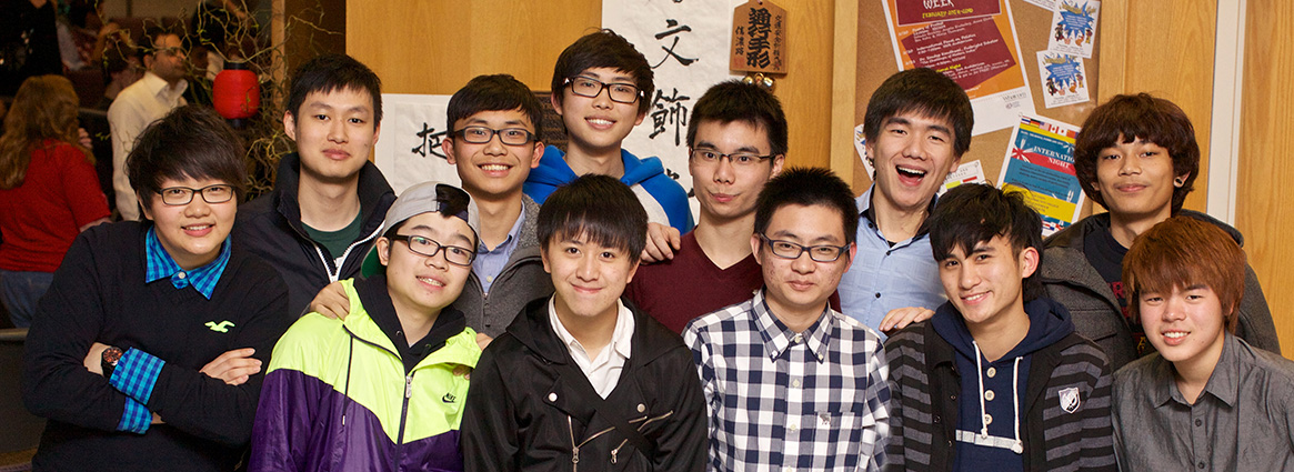 International-male students grouped together smiling