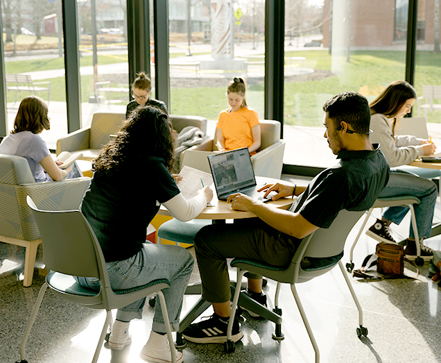 Running Start Students sitting in the Phyllis and Charles Self Learning Commons studying