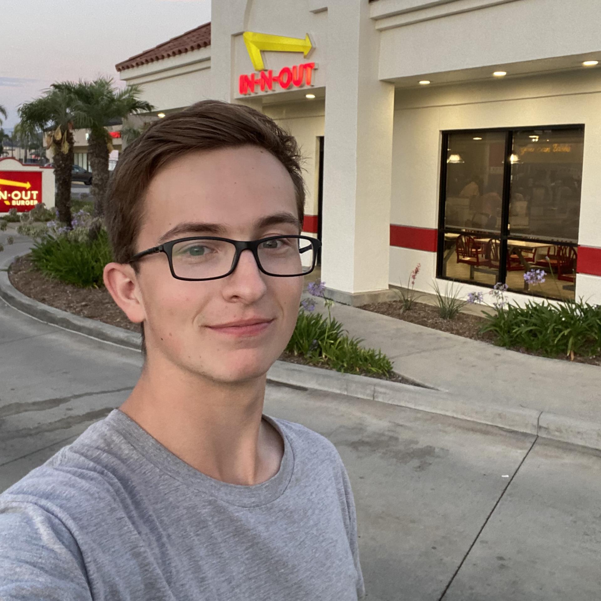 Portrait of Zach Enertson in front of an In-N-Out