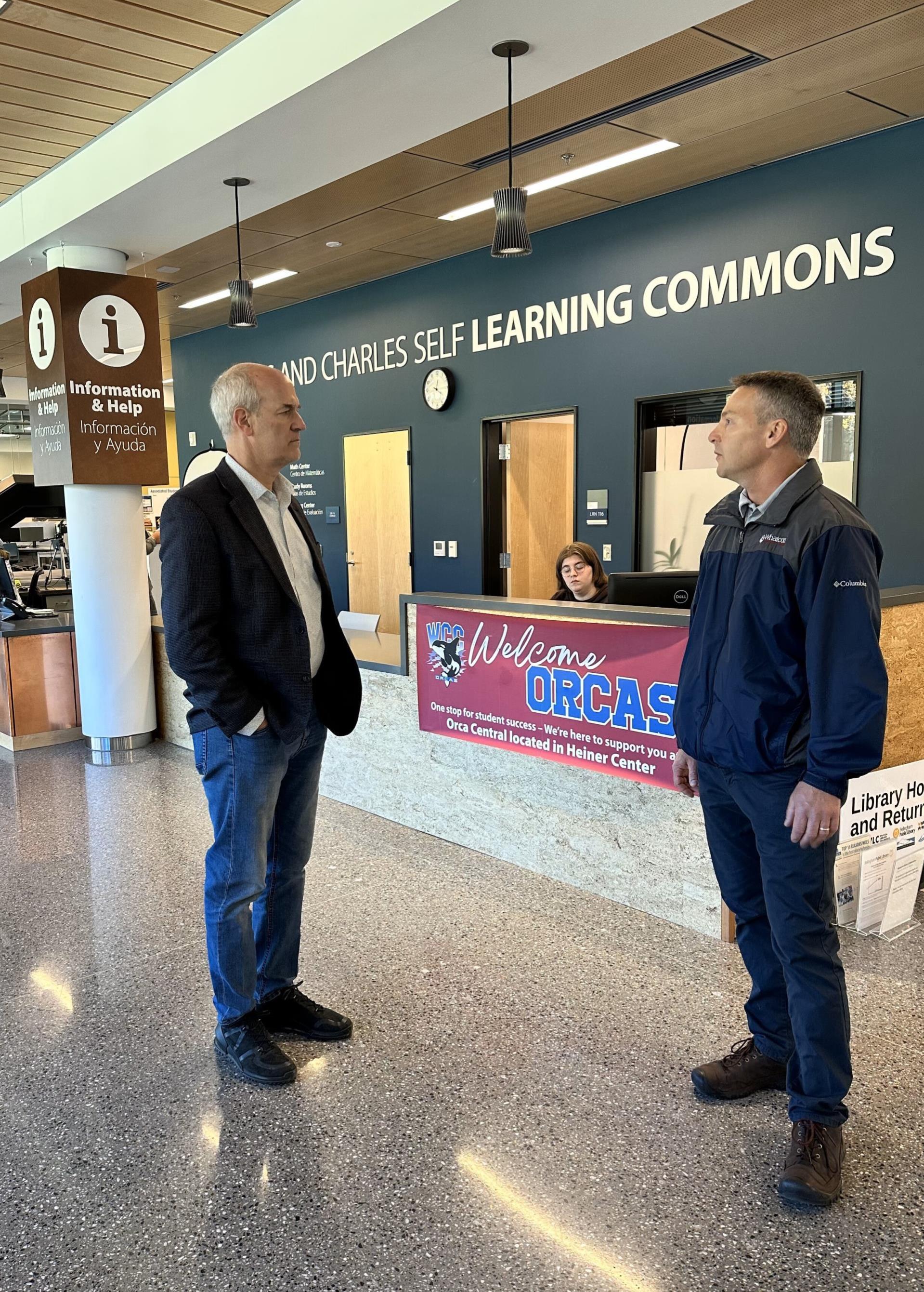 Rick Larsen standing next to Brian Keely in the Learning Commons