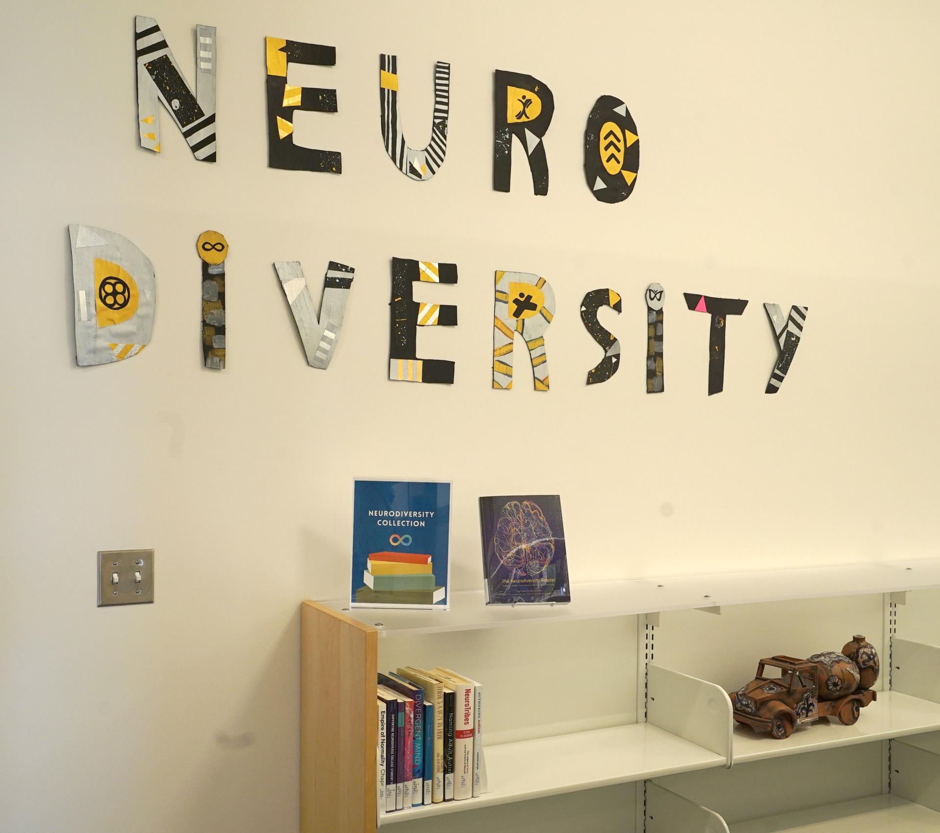 neurodiversity collection sign and bookshelf at the library