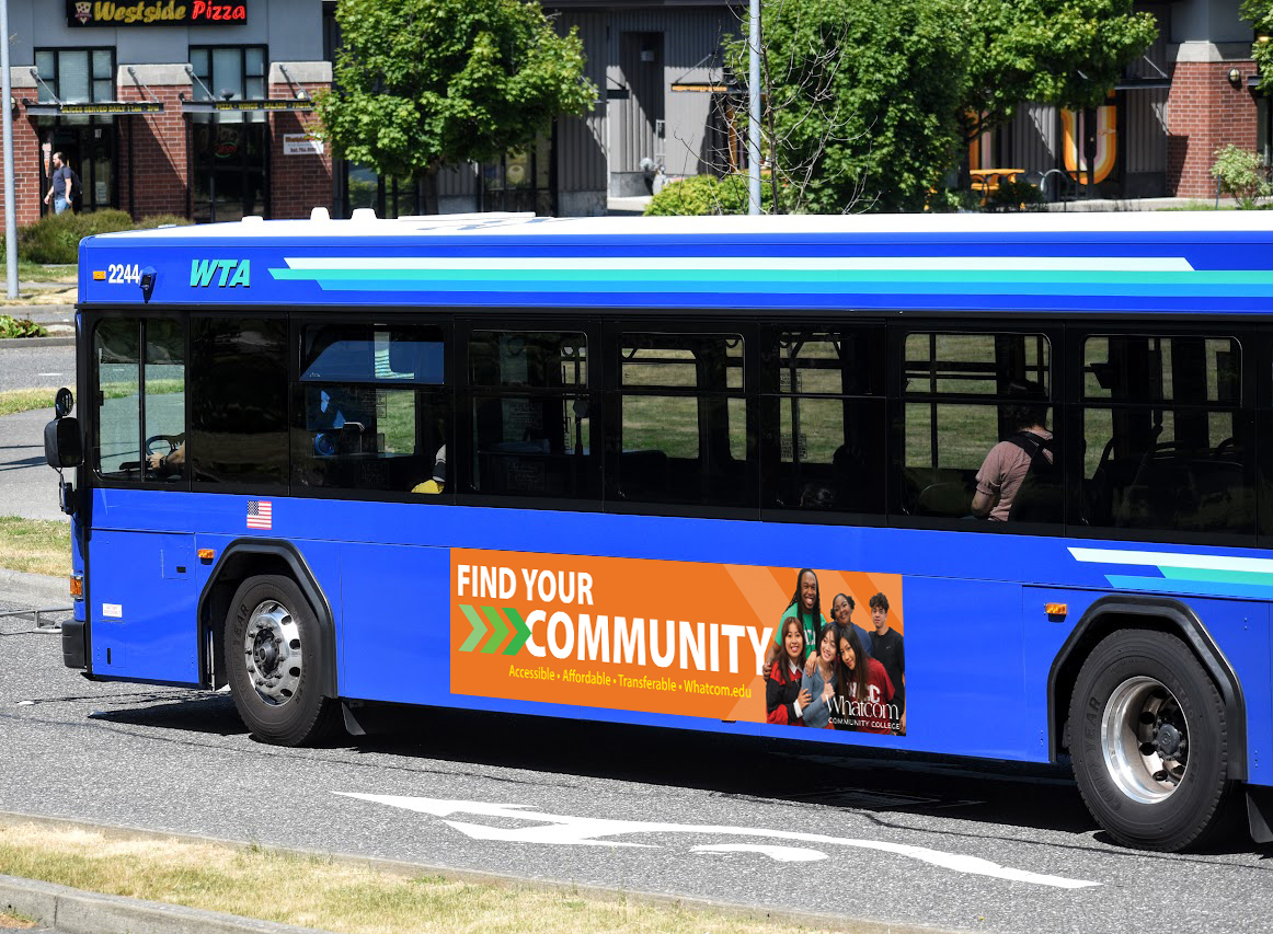 a bus side that says find your community on a city bus