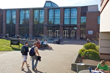 Syre Student Center with students walking around quad
